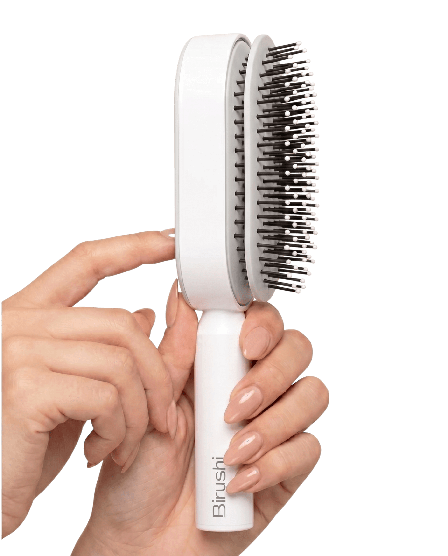 Pression sur le bouton au dos de la brosse Birushi